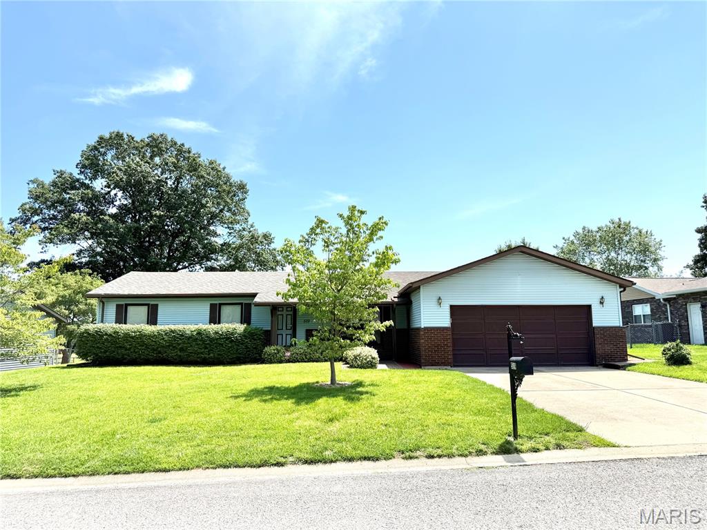 This one checks all the boxes - and then some! Extremely well cared for, this 3bd, 2ba ranch offers an excellent floor plan, fantastic curb appeal, beautiful landscaping including a few new trees, and numerous updates throughout. You'll love the covered front porch, side garage access, and convenient paver path that wraps around to a bonus low-step side entrance with parquet flooring. Front foyer features traditional wood plank flooring and a coat closet. The breakfast room has a bay window above the coffee nook/ bar/ desk/ prep counter - you name it - adjacent to the kitchen. The kitchen also features traditional wood plank floors and wood cabinets, all in excellent condition, and a gas stove with above vent hood. The one owner refrigerator was new in 2013. The dishwasher (new in 2018) has barely been used and is still like new! Recent updates include a new roof (2-3 years old), a 2025 HVAC system, and a water heater in 2017.  Newer wood look laminate flooring in hallway and all bedrooms. The den is a standout, complete with an electric fireplace, along with separate doors to garage, basement, and bonus side entry, along with many closets - including prior main level laundry (currently a closet or bonus pantry). The newer glass doors with built in blinds open to an oversized paver patio with vinyl privacy panels - currently overlooks a farm field. Additional storage is available in the backyard shed. Full dry basement with painted floor is home to current laundry, an extra closet, bonus storage room, and has potential for additional future bath. This one is move-in ready, so don't wait!