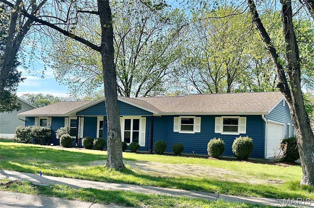 Completely updated with newer roof, siding, windows, hvac, water heater and more! This 3 bedroom, 2 bath gem with an oversized two car side entry garage features a fenced back yard on a corner lot with updates galore! Fall in love with the open floor plan featuring a spectacular family room off the breakfast room and the completely updated kitchen that opens to the foyer and the living room. The primary bedroom has a gorgeous renovated on suite and closet organizing system. The two secondary bedrooms feature new fixtures and are serviced by yet another fully renovated bathroom. The location is serene and close to schools, highways and historic Main Street. You are going to love the recently installed heat pump which will save you $$$! Do not blink or you will miss this one!