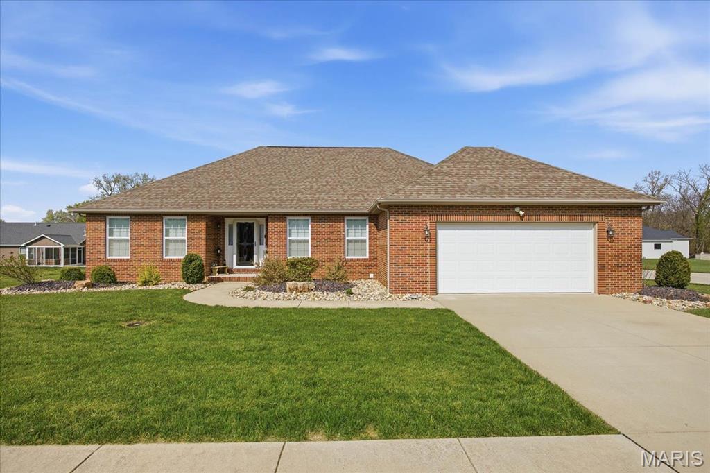 This beautiful, move-in ready partial brick ranch—built in 2017—is perfectly situated on a professionally landscaped corner lot. Offering approximately 2,200 square feet of main-level living space, this home combines modern comfort with thoughtful design. 
Inside, you’ll find 3 spacious bedrooms and 3 full bathrooms. The open-concept kitchen and dining area is ideal for both everyday living and entertaining, featuring custom cabinetry, stainless steel appliances, solid surface countertops, a pantry, and elegant ceramic tile flooring. 
Just off the kitchen, the inviting family room boasts a vaulted ceiling and an open staircase that leads to a full basement complete with its own full bath. The split-bedroom layout ensures privacy, with a generously sized primary suite that includes a large walk-in closet and private bath. 
Convenience is key with a spacious main-floor laundry room that makes daily chores effortless. 
Step outside to enjoy a concrete patio with direct access from the kitchen and dining area—perfect for outdoor entertaining. A two-car attached garage offers ample space for vehicles and storage. 
The full unfinished basement, complete with a full bath and egress window, provides endless possibilities to customize and expand your living space. 
To top it all off, a whole-house generator ensures you’ll always have peace of mind, no matter the weather! New carpeting throughout in 2025. Main floor completely repainted in 2024!