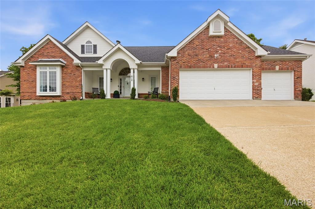 Welcome to 610 Dartmouth Crest Drive. Exceptional 4 bed, 3 full bath open concept, light filled atrium ranch located in The Estates of Dartmouth offers over 3,000 square feet of light filled finished living, nestled on a 0.36 acre lot. Refined curb appeal welcomes you with a stately elevation, covered porch and lush landscaping. Step inside to a stunning view through atrium windows overlooking the private back yard. The spacious great room with vaulted ceiling offers a gas fireplace with marble surround and sculptured built-ins, newer luxury vinyl plank flooring and statement lighting. Off the great room, find a beautifully updated kitchen showcasing stone countertops, custom cabinetry, SS appliances, center island, breakfast bar, dual pantries and opens to the adjoining breakfast room with a two story bay window. The breakfast room flows into the formal dining room and provides dual access to a spacious, covered side deck. The main floor primary bedroom boasts a vaulted ceiling, walk-in closet and a generous ensuite bath with dual vanity, separate shower and jetted tub.  A second guest bedroom with a full hall bath and laundry room complete the main level. The finished lower level includes an expansive family room/recreation area with wet bar, two additional guest bedrooms, a full bath and ample storage. Enjoy the level, fenced, tree lined backyard. Additional features include an oversized, three car garage and full lawn irrigation. Located on a culdesac street and within the award winning Rockwood School District - convenient to nearby schools, amenities and easy access to highways.