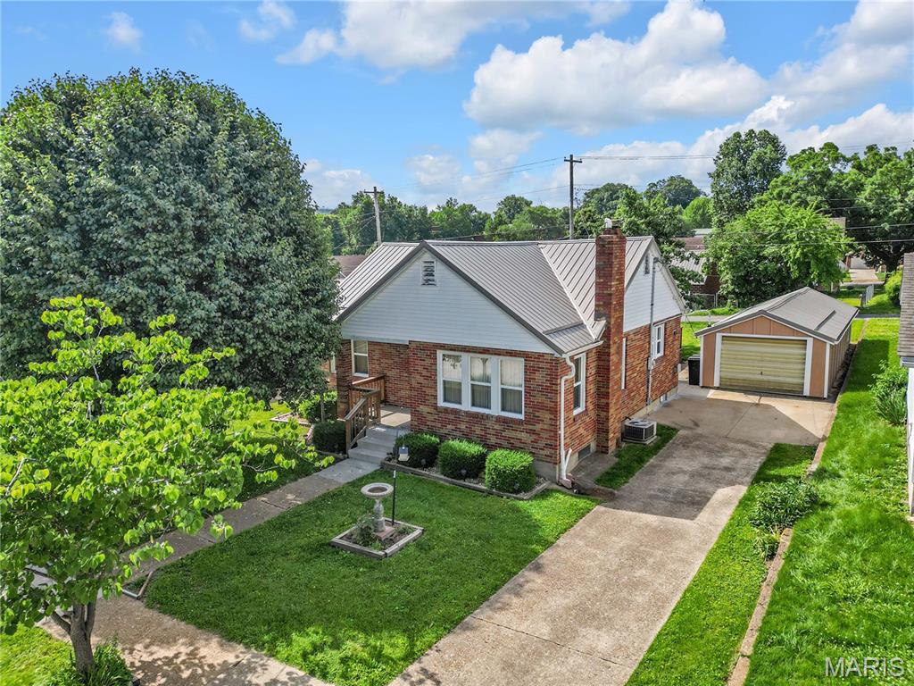 Welcome home to this charming brick 3-bedroom home built in 1977, nestled in a wonderful residential neighborhood with walking distance to nearby parks, and schools. Inside, you’ll find timeless character with beautiful arched doorways, plenty of storage space throughout the main level, and vinyl insulated windows for efficiency and comfort. The home also features a durable metal roof, newer front porch, and an updated deck perfect for relaxing or entertaining. Outside, the cute manicured yard offers inviting curb appeal along with a large detached garage/shed providing excellent storage or workshop space. The unfinished basement includes a half bath area and laundry currently located downstairs, with potential to relocate laundry to the main level if desired. This well-maintained property offers solid construction, classic charm, and a location that’s hard to beat.