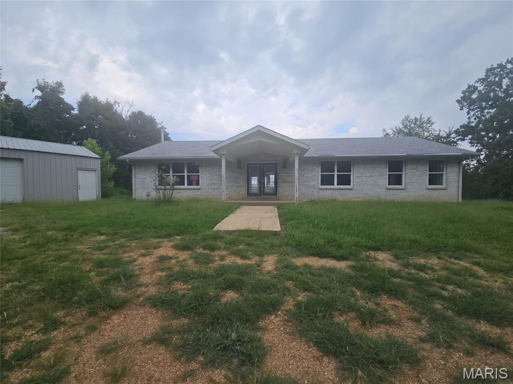 Spacious Brick Ranch on 25 Acres! Enjoy the privacy and versatility of this 2,009 sq. ft. brick ranch situated on approximately 25 acres. The property features an oversized two-car garage/workshop with plenty of room for vehicles, equipment, hobbies, or additional storage. A great opportunity for those looking for space, privacy, and the flexibility that comes with acreage. Schedule your showing today!