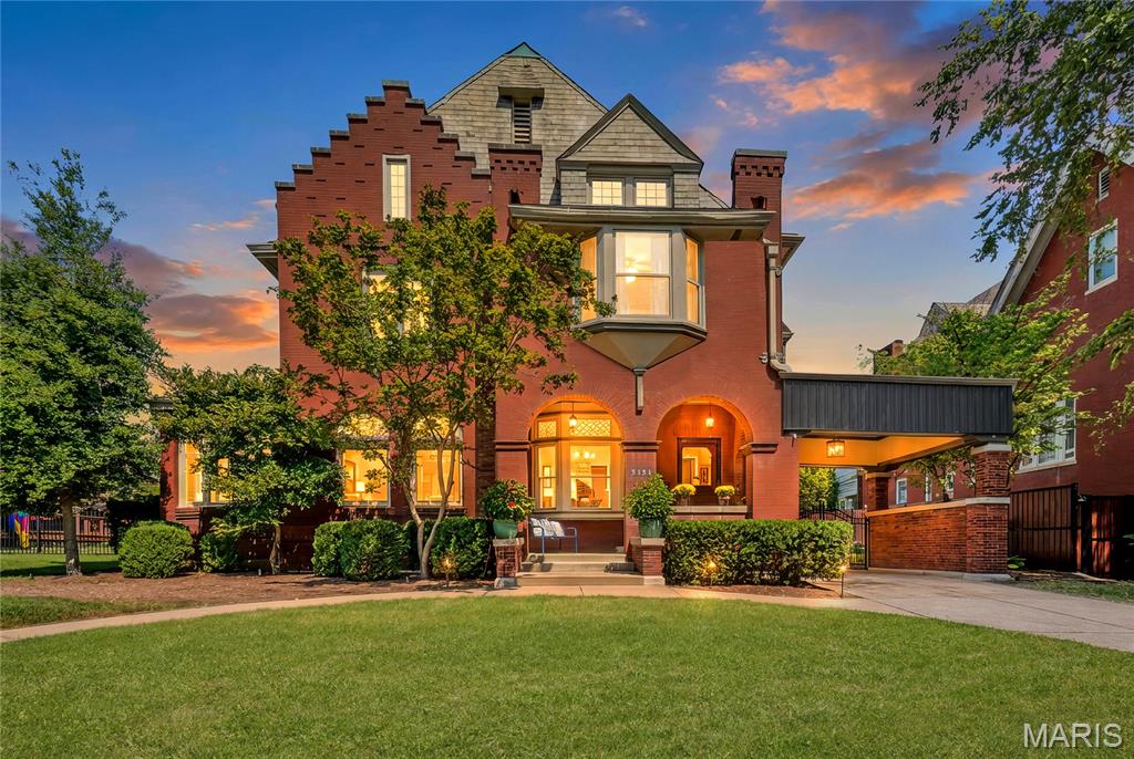 Step into this extraordinary Dutch Renaissance Revival masterpiece designed by renowned architect Theodore C. Link for Louisa Anheuser of the Anheuser-Busch dynasty.  Offering over 5000 square feet of creatively renovated and restored living space, this is a rare testament to opulent 19th-century craftsmanship in the prestigious Compton Heights community of St. Louis.  

The enticing circular sidewalk & porte-cochere will draw you into one of the most architecturally significant homes in a neighborhood of architectural masterpieces, with a welcoming covered porch beneath a striking crow-stepped gable roof and oriel window above Romanesque entryway arches.

Greeted by remarkable original millwork, intricate wood carvings, and exquisite masonry craftsmanship, you will find the grand fireplace commanding your attention, flanked by breathtaking art-glass windows bearing the iconic Anheuser-Busch insignia. 

Modern living meets historic grandeur with a well-designed kitchen featuring granite-topped custom cabinetry, breakfast & coffee bars, a butler's pantry, and premier appliances including a Wolf commercial stove, spacious dining and living rooms, and a sun-drenched solarium. 

Ascend the sweeping staircase where original stained glass filters light into a kaleidoscope of color ~ a daily reminder of the remarkable family who once called this their home. 

The second and third levels feature a peaceful primary bedroom suite & renovated bath, spacious bedrooms, two additional full baths, ample closet space, and plenty of room for everyone.

This estate extends beyond the main residence, offering a handsome carriage house ~ once home to Clydesdales, two large workshops, a three-bay garage, and fully appointed guest quarters ~ truly a magnificently functional compound! 

Not just a house, this is a piece of St. Louis history waiting for its next great chapter as you make this your own place to call home! 

Note: two home offices are not depicted in photos ~ one each on the first and second floor. 

If you are not familiar with Compton Heights, this sought-after community is bustling with neighbor-centric activities year-round, from a festive Easter Parade and egg hunt on the shady neighborhood park grounds to neighborly summer patio gatherings, movie nights in the meadow adjacent to the community garden, Halloween festivities like no other, a holiday caroling dine-around, and impromptu neighborhood gatherings!

Just minutes from major medical centers ~ SLU, BJC, Siteman, and Children's Hospital, and Washington University, Tower Grove and Forest Park, services, and restaurants.