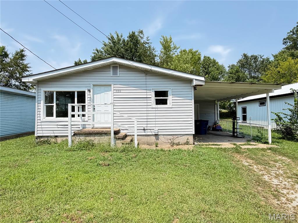 Affordable 2-Bedroom Home with Investment Potential in Salem, MO! Don't miss this affordable opportunity to own a 744 sq. ft., 2-bedroom, 1-bath home in Salem, Missouri! Whether you're a first-time homebuyer, looking to downsize, or searching for your next investment property, this home offers plenty of potential. With a little TLC and your personal touch, it could become a cozy place to call home or a great addition to your rental portfolio. Step inside to a bright and inviting living room that flows into the eat-in kitchen, offering ample cabinet and counter space for meal preparation and everyday living. The primary bedroom measures approximately 11' x 10', while the second bedroom is 9' x 9', making it ideal for a guest room, child's bedroom, or home office.  Vinyl flooring runs throughout much of the home, and the full bathroom is conveniently located near both bedrooms. Outside, you'll appreciate the attached one-car carport, providing covered parking and easy access to the home. Just beyond the carport is a separate laundry room with additional storage space, keeping the laundry area tucked away while adding extra functionality. The smaller front and backyard are perfect for anyone looking for a low-maintenance property with minimal landscaping to maintain. Conveniently located in Salem, you'll be just minutes from shopping, schools, restaurants, parks, and other everyday amenities. Whether you're looking for an affordable starter home, a low-maintenance residence, or an investment property with great potential, this home is worth a look. Schedule your private showing today and see the possibilities for yourself!