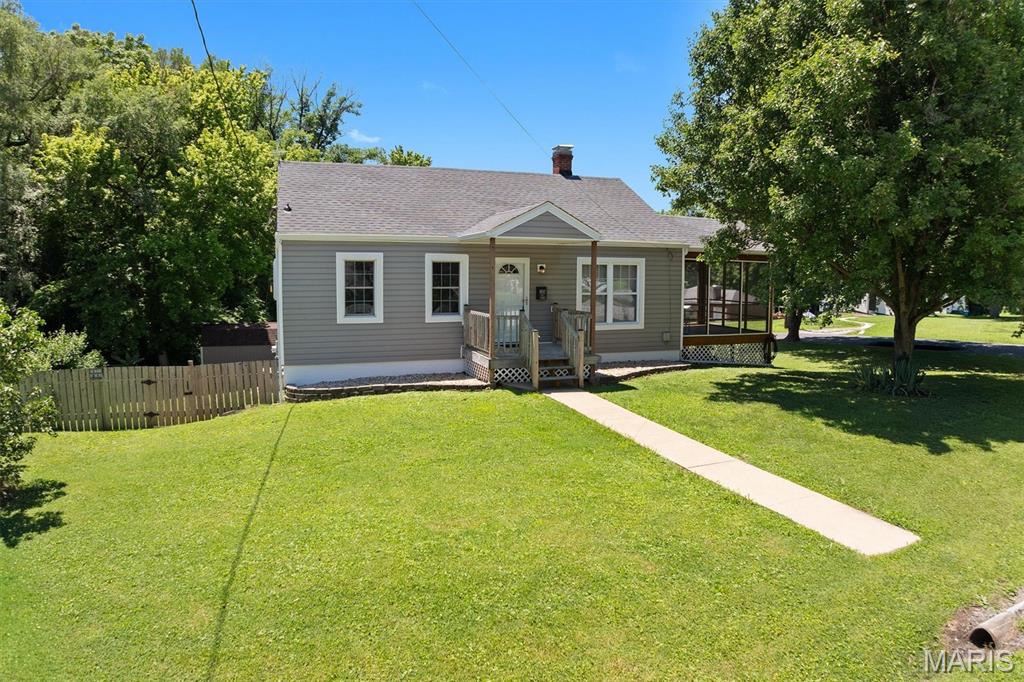 Welcome to this well maintained 2 bedroom 1 bath home with two car garage and partially finished basement on a corner lot.  Home has a gas fireplace in the basement, also a brand new water filtration system in place.  Home has an office that you can use whatever you desire, also a bonus room in the basement as well. There is also a screened in deck on the side of the house for your rest and relaxation.   Home will also have passed occupancy so you can move right in.  Make this your next home.