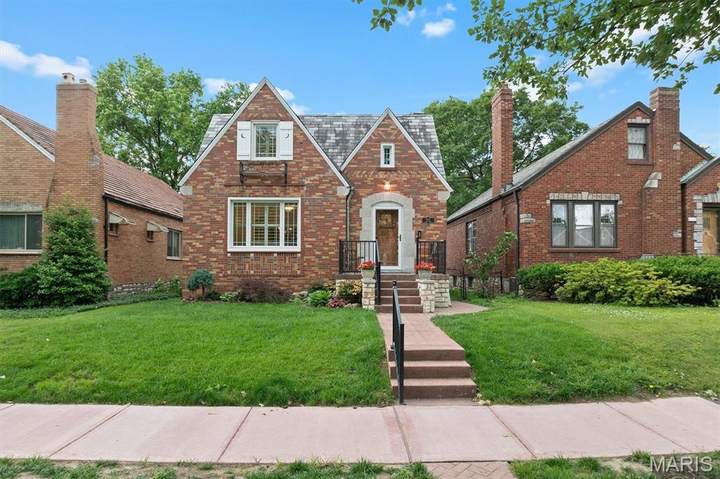Charming curb appeal and thoughtful updates welcome you to this beautifully maintained 1.5-story brick home in highly desirable St. Louis Hills. Fresh walkways and updated landscaping set the tone, and the natural light inside seals the deal. The living room features a decorative fireplace and opens right into a spacious dining room where original stained-glass windows add that classic South City character everyone loves. Polywood shutters and new Renewal by Andersen windows give the whole home a polished, energy-efficient upgrade. The expanded kitchen is a standout—custom cabinets, granite counters, Marvin windows, and a bright breakfast nook that walks out to the fenced backyard. It’s the kind of space that works just as well for morning coffee as it does for weekend entertaining. Hardwood floors run throughout the main level, along with two comfortable bedrooms and a full bath. Upstairs, the converted attic becomes its own retreat: a private primary suite with a newly updated walk-in shower, Pergo flooring, great closet space, and even room for a potential 4th bedroom or sitting area. The lower level adds even more flexibility with a finished office/craft room, laundry area with utility sink, workshop/hobby space, tons of storage, potential family room and walk-out access to the backyard and patio. Outside, the fenced yard is perfect for gatherings, and the detached garage—with a brand-new concrete floor—plus an attached carport gives you plenty of parking and storage options. And you’re just minutes away from parks, schools, restaurants, and neighborhood shops. A truly special home with space, thoughtful updates, and that St. Louis Hills charm. Ask your agent for the full list of upgrades!