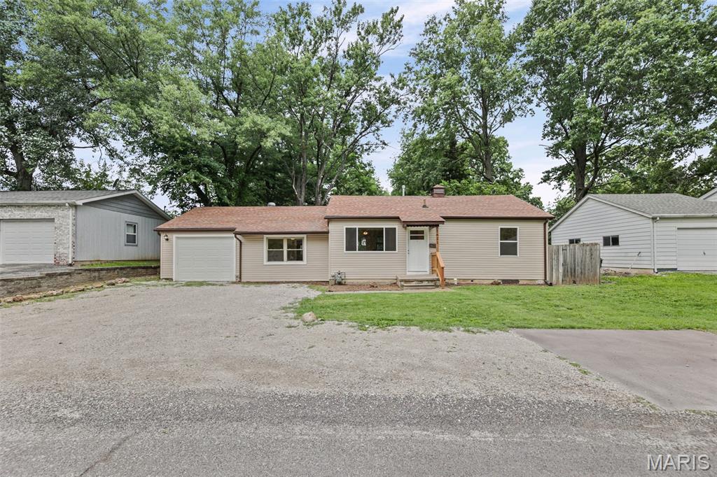This wonderful newly renovated 3 bedroom 1 bath home is a must see!!   Walk into a welcoming living room with a big window out to the front.  Walk thru to the kitchen that has all new cabinets -soft close, new stainless steel dishwasher, refrigerator, gas Stove/oven, microwave and a garbage disposal. The glass door from here takes you to the 12 x 10 wooden deck and large back yard with a 9 X 12 shed for all your outdoor toys.  Go to the left from the living room down 2 steps to a spacious bonus room with a large walk in laundry closet. One of the 3 bedrooms is on this side as well and has a large window for tons of natural light to come in. The 1 car garage is off the bonus room too. Now take yourself from the kitchen to the right side of the house to the 2 other bedrooms and full bath room, all with either new carpet or vinyl flooring.  This home has updated plumbing and electrical thru out, new siding, garage door & opener, Hot Water heater w expansion tank, 3/4 of the windows are brand new, Furnace and A/C are roughly 2 years old and Roof put on 2016.   There is also a whole house fan to help with those hot summer days.   Call your favorite agent to get into this home before its gone!
