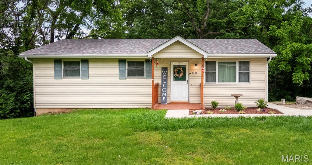 Tucked away on a private .84-acre lot backing to mature trees, this move in ready 3-bedroom, 1-bathroom ranch is a great opportunity for a first-time buyer or anyone looking for an affordable home with a peaceful setting.  Step onto the covered front porch and into a living room that feels bright and welcoming, anchored by a large picture window that fills the space with natural light. Laminate flooring runs through the living room and hallway for a clean, cohesive look. The eat-in kitchen has been updated with 42-inch cabinets, pantry storage, and hardwood flooring… functional and attractive. Three comfortable bedrooms and a full bathroom round out the main level. The unfinished walkout basement offers real potential.  Finish it for additional living space or use it for storage, with direct access to the backyard. The driveway is large enough for several vehicles. A solid, well-kept home in a quiet, private setting. Schedule your showing today!
