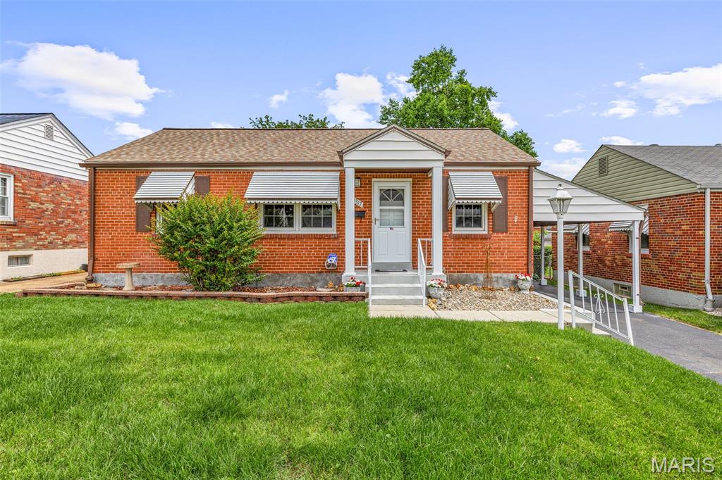 Darling brick home loaded with charm and updates! This well-cared-for 2 bedroom, 1.5 bath home features beautiful wood floors and an open floor plan perfect for everyday living and entertaining. Fantastic enclosed porch off the back of the home overlooks the amazing yard complete with a shed and carport. The lower level offers additional living space with a sleeping area, living area, and half bath. Major updates include updated windows, new HVAC in November 2025, and a new roof in March 2024. Fantastic location close to shopping, dining, and more!