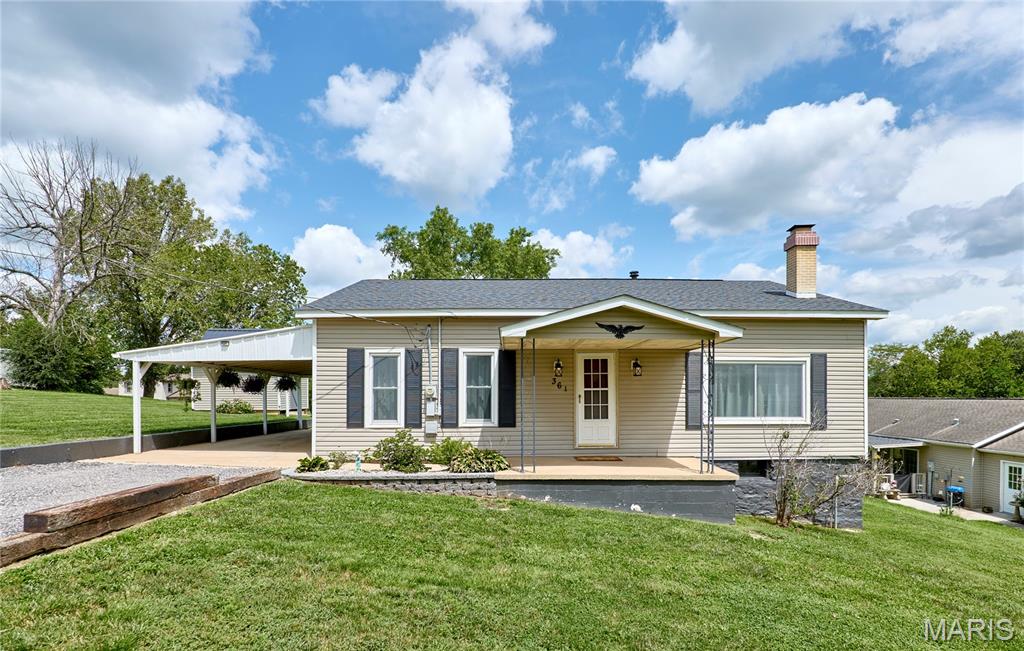 Charming, updated, and move-in ready! This adorable 3-bedroom, 1-bathroom ranch sits on two spacious city lots and features a large, updated kitchen with abundant cabinet and counter space. Premium peace of mind comes standard with a recently replaced roof, newer solid surface flooring and carpet throughout, and an included 1-year home warranty. Enjoy a bright sunroom, a cozy gas fireplace, a fully fenced backyard, and a handy storage shed equipped with electricity. This exceptional value won't last long—schedule your tour today!