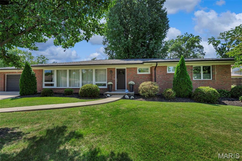 Beautifully renovated and completely turn-key, this 4-bedroom, 3-bath ranch offers exceptional craftsmanship, a thoughtfully designed floor plan, and a fantastic cul-de-sac setting in a sought-after neighborhood within the Ladue School District. The bright, open interior flows effortlessly from one space to the next, with a stunning gourmet kitchen featuring marble countertops, custom cabinetry, and high-end finishes at the heart of the home. The adjoining family room is warm and inviting with a fireplace and dramatic floor-to-ceiling windows that fill the space with natural light. The main level includes a beautifully finished primary suite along with two additional bedrooms and completely updated baths featuring subway tile, new vanities, tile, fixtures, and tasteful finishes throughout. The finished lower level extends the living space with a private fourth bedroom with egress, full bath, spacious family/rec room, and a large storage area. Outside, the expansive 25' x 20' patio with built-in brick grill provides the perfect setting for entertaining and enjoying the backyard. Beautifully updated from top to bottom with quality craftsmanship and timeless style, this is a rare opportunity for truly move-in-ready living in an exceptional location with Ladue Schools.