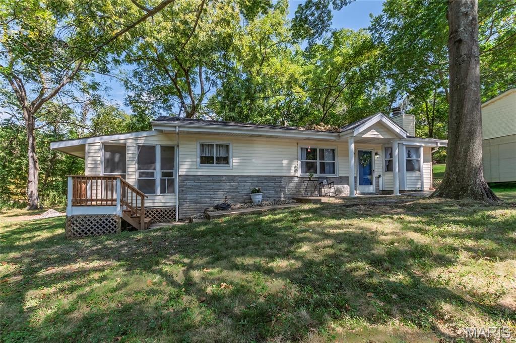 Lovely Ranch home in Lake Lorraine subdivision sitting on two treed lots.  This property features two large Bedrooms and one updated Bathroom. It could easily be converted to a three Bedroom if needed. The updates include a New Roof 2025, New HVAC 2026, New Carpeting 2026, Fresh Paint through- out 2026, Updated Bathroom 2026, New Lighting 2026, New Doors 2026, New Front Porch with Stairs 2026, Trees trimmed 2026, the list goes on and on!  Enter and find a pretty Dining Area adjacent to the Kitchen and Office.  The large Living room features a cozy wood burning Fireplace surrounded by stone. A Bay window offering lots of natural lighting.  The door in the back of the room, exits to a huge Deck and flat backyard perfect for Bar-be-ques. The Kitchen features a large island and lots of cabinets. A beautiful white screened porch is a three season space. Quiet and relaxing perfect for your morning coffee or reading a book. Completely updated Bath, next to the main floor Laundry with Storage.  The Master Bedroom is large and has space for a sitting area and TV.  The 2nd Large Bedroom is divided into two spaces with a step.  Bedroom and Dresser in one and private Den or Office in the second.  Home Warranty being offered for new Buyers by Sellers for 1 Year.  Within walking distance of the beautiful Lake Lorraine, perfect for a pontoon, fishing or swimming.