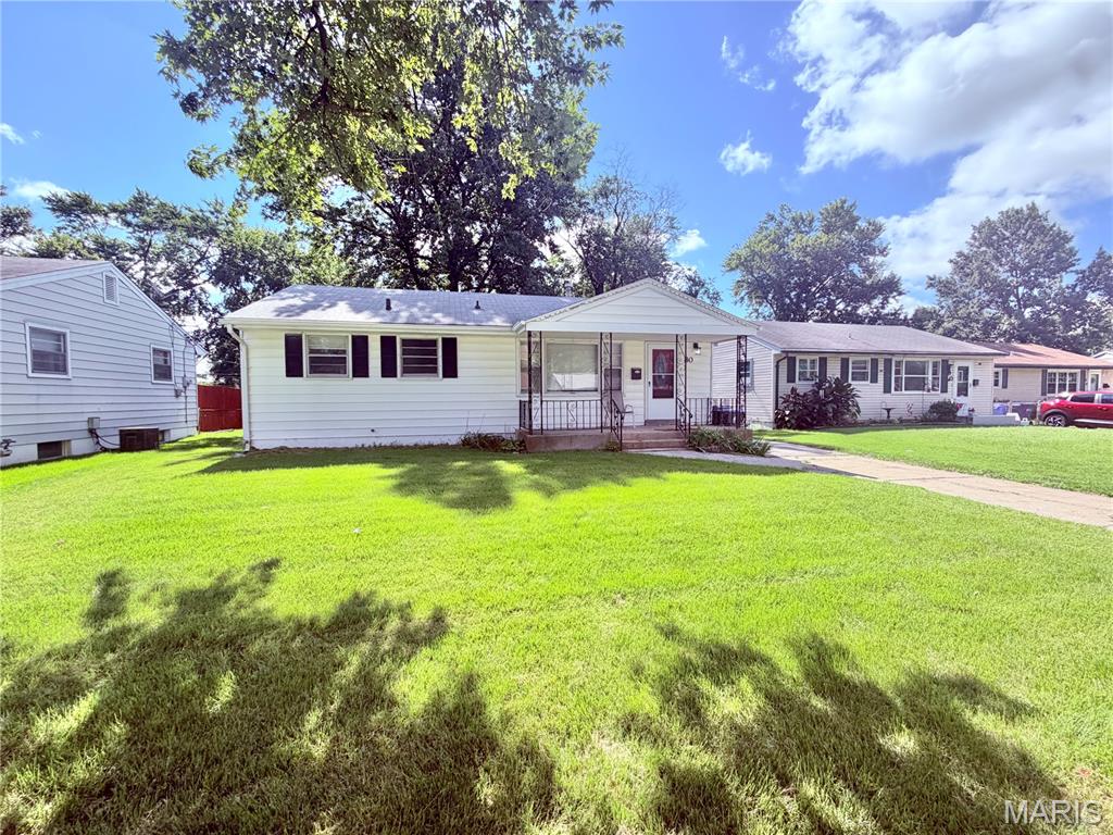 Charming and move-in ready, this 3-bedroom, 1-bath home offers a comfortable layout with thoughtful updates throughout. Fresh paint and a mix of hardwood and laminate wood flooring create a clean, welcoming feel from the moment you step inside. The bright living room offers plenty of natural light, while the kitchen provides an abundance of counter space for meal prep, storage, and everyday convenience. Three bedrooms and a full bath complete the main living area. The unfinished lower level offers excellent storage and plenty of potential for future living space, a hobby area, or recreation room. Outside, enjoy a fenced backyard along with convenient off-street parking. With a manageable footprint, fresh updates, and functional spaces inside and out, this home is a great opportunity for anyone looking for comfort, value, and easy living.