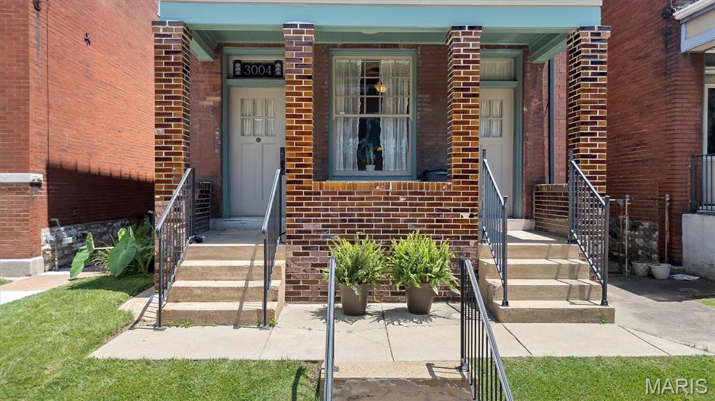 Welcome to Tower Grove East, one of our most beloved historic neighborhoods. This stunning 1908 brick home showcases the craftsmanship that defined St. Louis' architectural heritage, featuring eye-catching glazed brick, a stepped parapet and elegant Italianate limestone details.

Completely renovated in 2016, this former duplex is now a single-family home, with a custom floor plan designed for modern, multigenerational living. Warm pine floors on both levels create inviting spaces for everyday life and entertaining. At the heart of the home, the chef's kitchen is truly exceptional, featuring a large center island, breakfast bar and great pantry. Appliances include an induction cooktop and oven, built-in microwave, warming drawer - truly all of the things! The kitchen opens into a sought-after, main-level family room.  A bedroom and a full bath with walk-in shower round out the main level, perfect for when grandparents visit!

Upstairs, the expansive primary suite is a true retreat, complete with a coffee bar, sitting area and a dramatic wall of windows with access to the sweeping front balcony. The luxurious, light-filled primary bath features a custom-tiled wet room with soaking tub, and seamlessly connects to a professionally designed walk-in closet. There are two additional upstairs bedrooms, each with access to a back deck. One bedroom includes a Murphy bed, making it flexible space that works as a home office, workout room, or guest room. A generous hall bath, and a convenient second-floor laundry complete the upper level.

The outdoor spaces are equally appealing, with a welcoming covered front porch, expansive front balcony, and a spacious two-story rear deck. The back decks overlook a park-like neighborhood orchard that is permanently protected as green space! With the orchard as a backdrop, you're free to enjoy the low maintenance, fenced backyard, with parking pad and a paver patio!

Located just off Arsenal, the home offers quick access to Downtown and major highways, and also boasts one the city's highest walkability scores. Stroll to Tower Grove Park, Jay International Food Co., neighborhood cafés, and the acclaimed restaurants of South Grand. Showings begin July 9th —don't miss this extraordinary opportunity to own one of Tower Grove East's most distinctive homes.