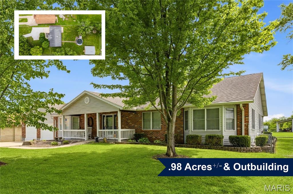 Hard-to-find one-story home in O’Fallon School District on nearly one acre (.98+/- acres). This property offers a country setting with the convenience of being close to shopping, downtown O’Fallon, Far Oaks Golf Course and Scott Air Force Base.

The main level includes a large family room with extended ceilings, a spacious eat-in kitchen with an oversized dining area, three bedrooms, and a primary suite with a full en-suite bath. Additional features include a half bath, main-level laundry, and a three-seasons room with new carpet. A covered back patio with multiple ceiling fans overlooks the fenced backyard.

The finished basement provides two bonus rooms, a second kitchen, a family/rec room, and generous unfinished storage.

A rare attached 4-car tandem garage with its own heater offers exceptional space for vehicles, workshop needs, or storage. The backyard includes an outbuilding (24x30) with a covered porch, ideal for equipment, hobbies, or outdoor use.

This home is move-in ready and offers the space and flexibility that are difficult to find in O’Fallon.