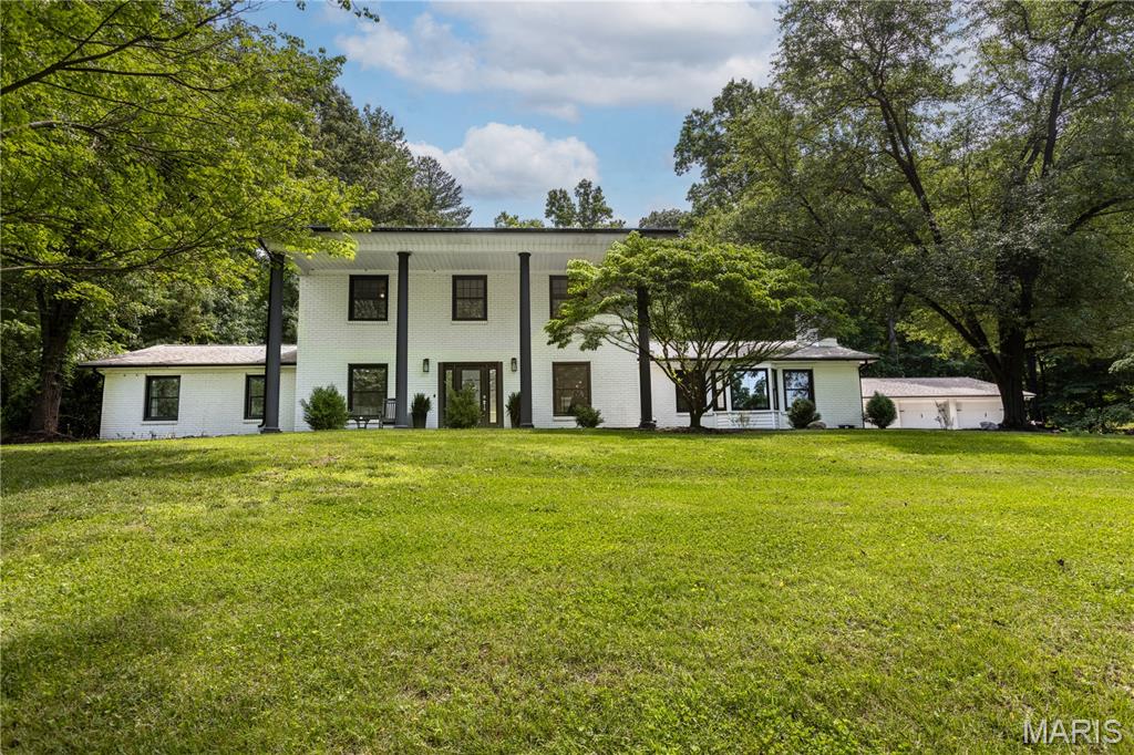 Welcome to this beautifully updated 4 bedroom, 4 bath Colonial-style brick home that perfectly blends classic charm with modern luxury.  Inside, every inch of this home has been thoughtfully and completely remodeled with high end finishes, contemporary design, and an open , light filled layout that's perfect for both everyday living and entertaining. This home has it all!  2 fireplaces, a primary bedroom suite on the main level and another one on the upper level, an ultra modern staircase, a built in wine cooler in the incredible kitchen island.  Walk in closets in every bedroom!  Step outside to your own private backyard oasis featuring a sparkling inground salt water pool with waterslide for ultimate summer fun and entertainment.  Call today for your private showing while this home is still available!