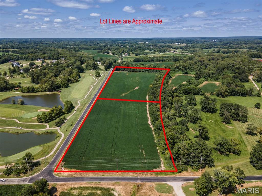 41.6+/- acres of level crop land with some woods. Price is $20000 per acre. Property fronts on Wood Station Road and Harris Lane.  Zoning is M-2 with the ability to zone for commercial, single family or multi family.  Seller will consider selling off smaller tracts.  
Survey to determine acreage.