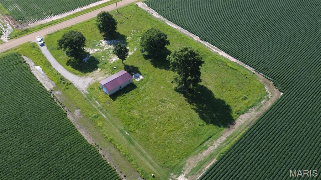 This level, 1.37 rectangular lot offers a versatile opportunity for investment, residential use, or recreational development. The property adjoins farm ground and includes a metal building/shop with gravel parking. Located just minutes from Otter Slough Conservation Area, the site provides convenient access to thousands of acres of managed wetlands known for exceptional waterfowl hunting, wildlife viewing, and outdoor recreation. Its proximity to Otter Slough makes this parcel well-suited for a private residence, weekend retreat, or a base for hunting and outdoor activities.