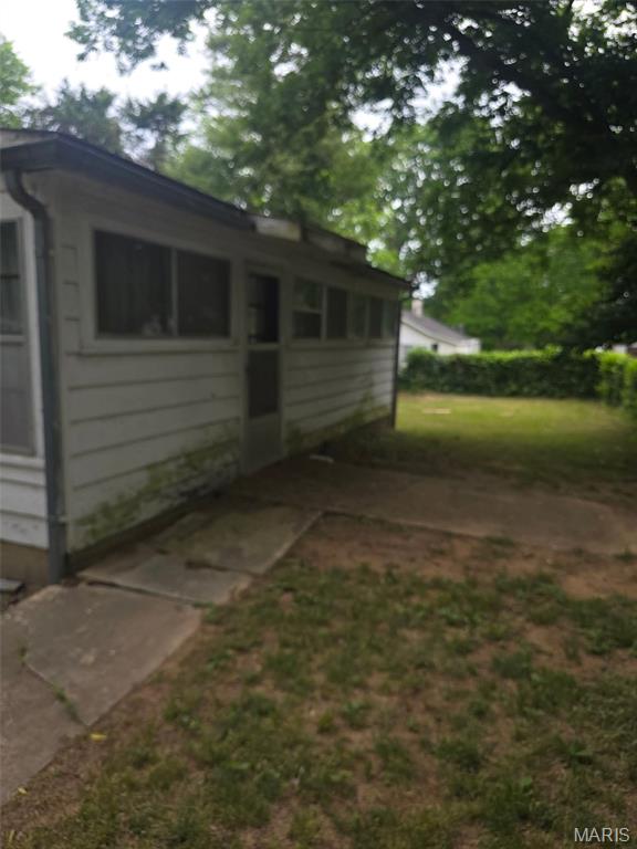 This property provides a distinctive chance for renovation and financial return. Featuring a living room, two bedrooms, one bathroom, large kitchen, and sunroom, the house has suffered minor fire damage limited to the roof. Additional features include a large fence, carport, two storage buildings, space heater, and window air conditioning. the potential for substantial financial gain renders this investment opportunity attractive to contractors.