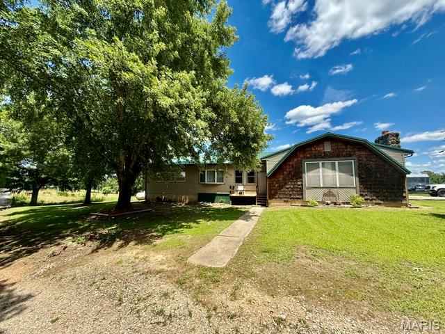 Country Living Near the Big Piney River! Nestled on 4.2 beautiful acres just outside of Houston, this spacious 3-bedroom, 3-bath home offers the perfect blend of comfort, functionality, and outdoor living. Located just one mile from the renowned Big Piney River, you'll enjoy easy access to floating, fishing, kayaking, and all the recreational opportunities the Ozarks have to offer. The Big Piney River is one of Missouri's most popular scenic rivers for outdoor recreation. Inside, you'll find a thoughtfully designed floor plan featuring two master suites, ideal for multi-generational living, guests, or added privacy. The home includes a partial basement, providing extra storage space or room for hobbies and projects. Outside, the property is equally impressive with an attached one-car garage, one-car carport, and a 32' x 26' detached shop complete with concrete floors and 220 electric, perfect for a workshop, equipment storage, or your next big project. Whether you're looking for a full-time residence, weekend retreat, or investment opportunity, this property offers the peace and privacy of country living while remaining just minutes from town amenities.