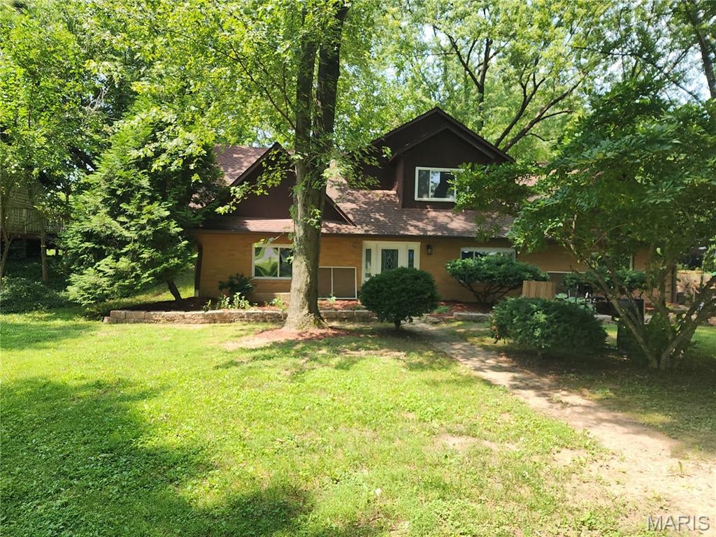 Bring your vision and unlock the potential! Nestled on a beautiful 2.08-acre setting in Edwardsville, this spacious home offers an exceptional opportunity for a buyer looking to build equity and create a home tailored to their own style. Surrounded by mature trees and natural beauty, the property provides the space, privacy, and flexibility that are increasingly hard to find.

Inside, the home features an open-concept feel with an exceptionally large living room, creating a wonderful gathering space for family and friends. The kitchen sits at the heart of the home and connects naturally with the main living areas, while a separate dining room provides additional space for everyday meals or entertaining. A bonus family room adds even more versatility and could serve as a second gathering area, game room, home office, or whatever best fits your lifestyle.

The upstairs primary bedroom offers generous space and the opportunity to create a truly personalized retreat. The primary bathroom will need updating or replacement, and the home would benefit from new flooring, fresh paint, and some minor drywall repairs. These improvements provide the perfect opportunity to bring your own design ideas and finishes to the home rather than paying for someone else's choices.

Outside, the 2.08-acre property is where this home truly shines. Mature trees, expansive green space, and a peaceful natural setting create a beautiful backdrop with plenty of room to enjoy the outdoors, garden, entertain, or simply appreciate the privacy of your own land. The spacious two-car garage provides excellent parking, storage, and workspace.

This is a property for the buyer who can see what it could become. Whether you're looking for a home with room to grow, a project where your improvements can translate into equity, or simply a property where you can make your own mark, 4847 Indian Hills offers tremendous possibilities.

Property is being sold AS-IS. Seller will make no repairs. Buyers are encouraged to conduct their own inspections and due diligence and evaluate the property and improvements to their satisfaction.

A large home. 2.08 beautiful acres. Endless possibilities. Bring your ideas and build the equity.