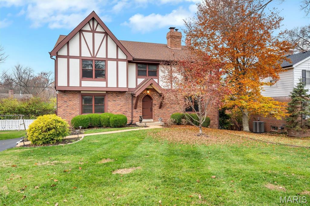 Tucked at the end of a quiet cul-de-sac in the coveted La Hacienda subdivision, this beautifully maintained two-story home offers exceptional light, inviting interiors, and the sought-after Ladue School District. The neighborhood is known for its warmth and sense of community and even welcomes more than 400 trick-or-treaters each Halloween.

Thoughtful architectural details, generous room sizes, and abundant built-ins create a welcoming sense of home from the moment you enter. A dramatic two-story living room showcases soaring Andersen insulating windows (all replaced in 2017), custom bookcases, and a handsome fireplace. The open loft above adds versatility as a reading nook, study space, or retreat. A spacious formal dining room offers an elegant setting for gatherings, while the warm wood-paneled den—with its second fireplace and full wall of built-ins—invites cozy everyday living.

The well-scaled kitchen provides extensive cabinetry, broad work surfaces, an island with prep sink, and a casual dining area overlooking the private, secluded backyard. A sliding door leads to the large deck and 2016 hot tub/spa, ideal for year-round enjoyment. The exterior received a major upgrade in 2017 with full Hardie siding, and the landscaped grounds are supported by a 4-zone irrigation system with a 2023 Hydrawize smart controller.

Upstairs, the serene primary suite offers excellent closet space and a bright, well-appointed bath. Three additional bedrooms—one featuring custom artwork by local artist Stacy Self—provide flexibility for guests, family, or home office needs. The second-floor laundry room includes a utility sink, generous cabinetry, and ample countertop space.

The finished walkout lower level extends the living space with a built-in desk, patio access, rec room, and a large storage room. Additional features include 2021 Generac whole-house natural-gas generator with automatic switching, electric car charging, Infinity high-efficiency HVAC systems (2009) with air cleaners and humidifiers (professionally maintained semi-annually), whole-house Beam central vacuum, modular garage wall organizer, underground electrical supply (1995), new water meter and meter well (2025), and a 2024 leveled walkway with transferable warranty.

With its rare privacy, thoughtful upgrades, and exceptional community setting, this gracious home is ready to be treasured for years to come.