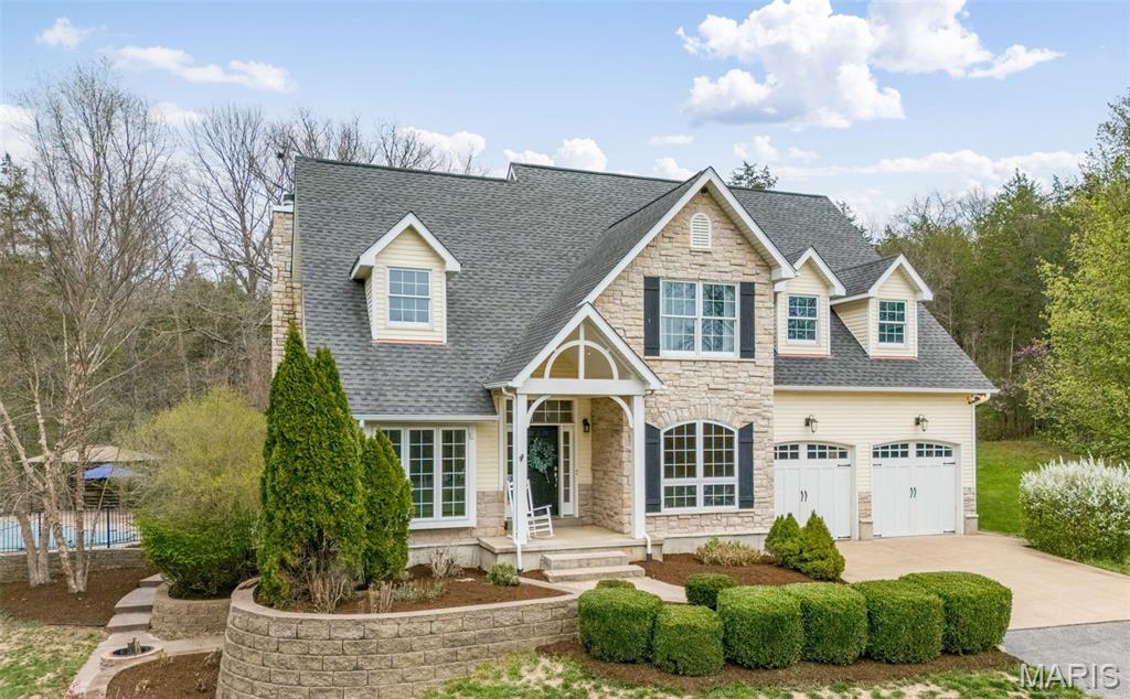 THIS IS A PLACE WHERE YOU WILL MAKE MEMORIES!  A custom-built, one-and-a-half-story residence privately situated on 10.96 partially wooded acres.  Beautifully upgraded, this exceptional property blends refined indoor living with resort-style outdoor amenities, all surrounded by the natural beauty and serenity of a wooded setting.  From the moment you arrive, a sense of privacy and peace sets the tone. Upon entering the home, you’re greeted by beautifully appointed living spaces that flow seamlessly from room to room. The formal dining room is an elegant space ideal for hosting dinner parties with its rich hardwood floors that add a timeless appeal, while the layout offers plenty of room for a large dining table and statement furniture. A dedicated den/library with glass French doors provides a flexible space perfect for a home office, library, or quiet retreat. The kitchen serves as the heart of the home, and has been thoughtfully designed with cream-colored cabinetry with select cabinets featuring elegant glass fronts that add visual interest and display opportunities.  Granite countertops provide both generous prep space for cooking and entertaining. A large pantry ensures ample storage, keeping the kitchen organized and clutter-free.  Whether entertaining guests or enjoying weeknight dinners, this kitchen is designed to gather people together comfortably and effortlessly.  Just off the main living areas, step outside onto the back deck featuring low-maintenance composite decking. This thoughtfully designed outdoor space extends your living area and provides an ideal spot for grilling, dining, or simply taking in the peaceful wooded surroundings.  One of the most captivating features of this property is the exceptional outdoor living space. The inground saltwater pool transforms the backyard into a private resort, inviting relaxation and fun throughout the warmer months. Designed for both leisure and entertaining, the pool area is complemented by a pergola and sun deck.  Whether hosting poolside barbecues, cooling off on hot summer days, or enjoying tranquil evenings under the stars, this outdoor oasis delivers an unparalleled lifestyle experience. The surrounding acreage ensures privacy and creates a peaceful setting rarely found in residential neighborhood.  The primary suite, located on the main level, is a true sanctuary. Spacious and serene, it provides a restful retreat at the end of the day.  The primary bathroom is designed with luxury and comfort in mind. Highlights include:  A relaxing soaking tub, double bowl vanity with ample counter space and generous layout conducive to a spa-like experience.  The walk-in closet is thoughtfully appointed with custom built-in organizers, providing exceptional storage and functionality while maintaining an organized and polished appearance.  The home offers a total of four bedrooms and three-and-a-half bathrooms, providing ample space for family, guests, or flexible living arrangements. Upper-level bedrooms are well-sized, offering comfort and privacy, while additional bathrooms feature quality fixtures and finishes designed to meet everyday needs with ease.  The finished walkout basement significantly expands the home’s living and entertaining space. Designed with modern convenience and style, this area features:  Luxury vinyl plank flooring, a stylish wet bar, built-in spirit coolers and a dedicated sleeping room ideal for guests.  With direct access to the outdoors, the walkout lower level is perfectly suited for entertaining, movie nights, game days, or multigenerational living. Don't miss the side patio with firepit.  Upgrades include:  Dual HVAC systems, dual hot water heaters, ceramic tile flooring and main floor laundry.  ALERT!!!  OUTDOORSMAN'S PARADISE, the owner has the ability to hunt the property and with extra tags.  And don't miss the chance to hike along the meandering creek or walk/ride the ATV trails.  START PLANNING YOUR POOL PARTY-THIS PROPERTY IS AMAZING!