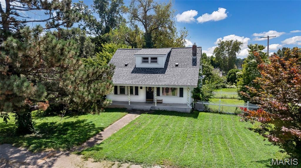 Exceptional value, classic charm, a rare double lot, thoughtful updates, and investment potential come together in this character-filled Overland home! Whether you’re looking for an affordable home to make your own or a property with added value, this inviting 1.5-story offers the warmth and craftsmanship of an older home with original wood flooring, doors, trim and millwork, abundant natural light, and a charming butler’s pantry connecting the kitchen and dining room.

The kitchen updates include light wood cabinetry, countertops, a gas cooktop/range, faux-brick accent wall and flooring. The kitchen refrigerator is included with the sale. The main level offers a bedroom with its own private deck/balcony, a full bath, and comfortable living and dining spaces, while upstairs you’ll find two additional bedrooms.

A standout feature is the newly repoured front porch extending across the front of the home with a full-length vault room beneath it, offering excellent secure-storage potential and the option to create a safe room with the addition of a steel door.

The walkout lower level provides additional storage and flexibility. Outside, the corner double lot gives you room to enjoy the outdoors with a level yard, charming white picket fence, a firepit area and generous off-street parking. The double lot includes the adjacent parcel at 2356 Huntington Ave.

Recent improvements include a new roof in 2025, updated electrical panel in 2021, rebuilt retaining wall, updated kitchen, and new sump pump in 2026.

Washer and dryer are also included with the sale. Property is being sold in its current as-is condition; seller will make no repairs.

With its combination of classic character, recent improvements, flexible space, and rare double-lot setting, this home offers an excellent opportunity for an owner-occupant or investor looking for value and potential. Enjoy a convenient Overland location close to Wild Acres Park, dining, shopping, and major roadways.