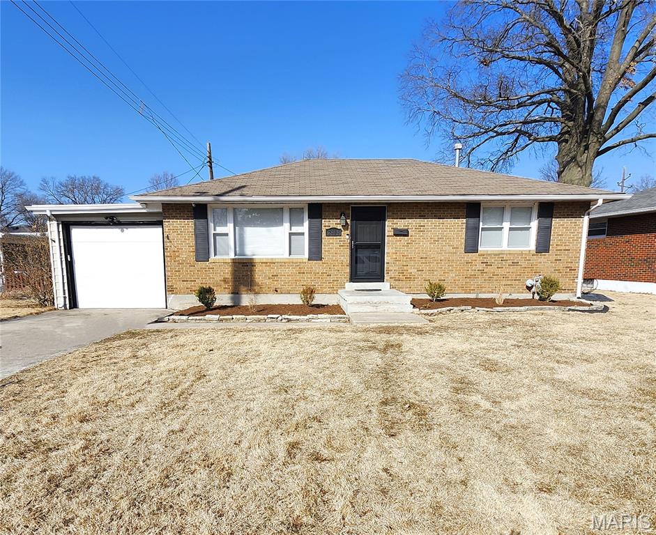 Swimming Pool season is approaching !  The patio, deck & pool are just a few of the attractions to this updated 2 Bedroom - 2 Bath brick ranch home. There's also a large bonus room downstairs w/ closet that is being used as Bedroom #3.  The wall separating the bright Living Room & Kitchen has been opened up to create a more spacious vibe. Hardwood floors in the living room AND both main floor bedrooms.  Updated eat in kitchen features oak cabinets, refrigerator, gas stove, dishwasher, built in microwave and plenty of space for the kitchen table. Vinyl replacement windows throughout. One car attached garage w/ new opener.  Downstairs, entertaining is easy in the huge 24 x 12 family room, featuring a bar and an Epson Projection TV system complete with pull down screen & surround sound equipment.  Besides the bonus sleeping room, there is also another finished room that could serve as an office, gym or recreation space. One more feature of the lower level is a Bathroom / Laundry Room combo with a gorgeous epoxy finish floor. This room features a toilet, vanity & mirrored cabinet, oversized glass door shower, PLUS a tidy laundry area with washer & dryer included.  The Backyard is fenced and offers a large deck on the back of the house overlooking an above ground pool and a concrete patio. There's also a large storage shed and block fire pit.  This home is being offered As-Is, but the seller has already completed AND passed the city occupancy inspection.  Conveniently located near shopping, restaurants & public transit. 30 minutes from Scott AFB & downtown St Louis.