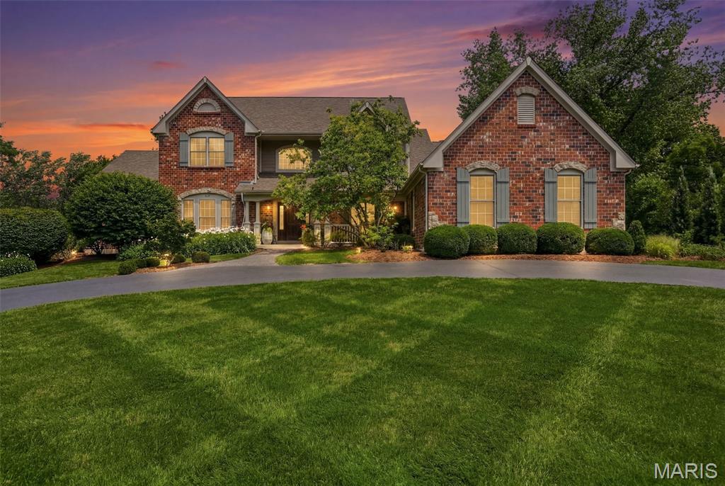 Tucked away on a private street in desirable Town & Country, this exceptional 4 bedroom, 5.5 bath residence offers a rare combination of luxury, comfort, and resort-style living. Thoughtfully designed with spacious gathering areas, refined finishes, and an incredible outdoor retreat, this move-in ready home delivers the lifestyle buyers are searching for. A dramatic 2 story entry welcomes you into a beautifully appointed main level where every space feels intentional. French doors open to a sophisticated den featuring custom built-ins, rich wood paneled walls, and a detailed boxed ceiling — the perfect setting for a home office or quiet retreat. The separate dining room provides an elegant space for hosting, while the stunning 2 story living room showcases a wall of windows, abundant natural light, and a gas fireplace creating a warm and inviting atmosphere. The heart of the home is the spacious kitchen and breakfast room featuring a large center island, stylish color-blocked cabinetry, walk-in pantry, and plenty of space for everyday living and entertaining. Just off the kitchen, the cozy family room with a stone-surround gas fireplace creates the perfect gathering spot. A convenient laundry/mudroom adds functionality to this well-planned main level. The luxurious main floor primary suite offers a private retreat with double vanities, jetted tub, walk-in shower, two walk-in closets, and a connecting door to the den for added flexibility. Upstairs, 3 generously sized bedrooms each feature their own private full bath, along with an additional open flex space ideal for an office, playroom, or hobby area. The finished lower level expands the living experience with a 9 foot pour and incredible entertainment spaces including a media room, billiards room, bar area, soundproof music room, additional bedroom, and full bath. Step outside to your own private oasis on a beautifully landscaped 1-acre lot with a wooded view. Enjoy evenings on the paver patio gathered around the custom fire pit, cooking at the custom grill center, or relaxing in the new 12 person Swim Spa. Additional highlights include a 3 car attached garage, updated Sonos sound system throughout the main and lower levels, and a new roof installed in June 2026. A truly special Town & Country home offering privacy, elegance, and a lifestyle unlike any other.
