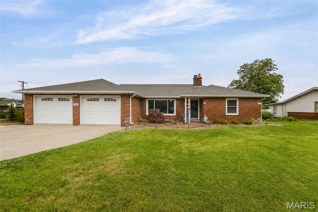 This full brick ranch has so much to offer inside & out! You'll be impressed with the spacious rooms, hardwood floors, built in cabinetry & more. Large living room. Eat-in kitchen features solid surface countertops, tile backsplash, cherry cabinets & stainless steel appliances. The dining room / flex room offers many possibilities & has backyard access. Split bedroom floor plan - Wood burning fireplace in primary bedroom; recently remodeled 3/4 primary bath includes large walk in closet. Bedrooms 2 and 3 are on the opposite end of the house with a full 2nd bathroom. Main floor laundry; washer & dryer stay. Full unfinished basement includes 2nd laundry hookup & plenty of storage space. Private backyard is fenced & includes a covered patio. Situated on a corner lot. Oversized 2-Car garage. New water heater 2026. Home Warranty included! Passed city occupancy inspection, this home is move in ready! Buyer to verify all information.