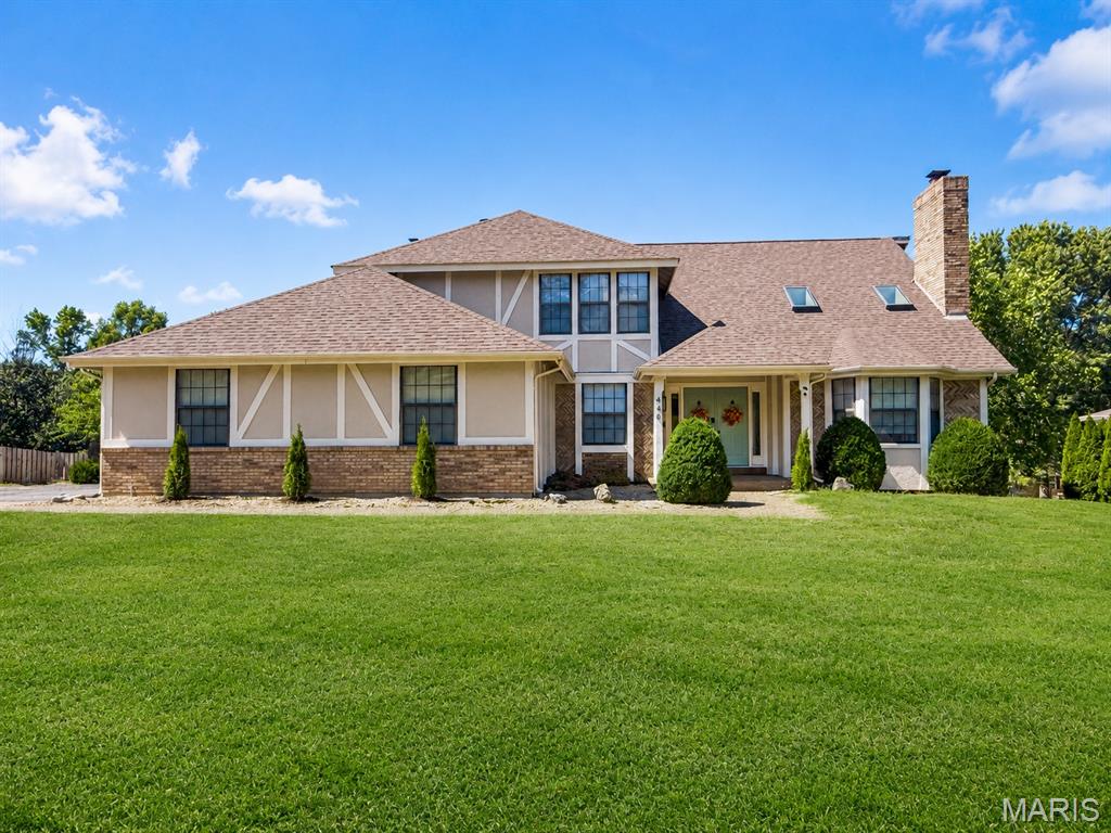 Welcome to 440 Meramec Way, an impressive 5-bedroom, 4-bath home offering approximately 4,799 sq. ft. of total living space, distinctive architectural details, and a backyard built for entertaining. With extensive renovations and upgrades, this exceptional home combines generous living spaces with numerous recent improvements.

From the covered front porch, step inside to a grand two-story entry where a sweeping staircase sets the tone for this exceptional home.

The main level offers an ideal combination of formal and casual living spaces. A private office or guest room provides convenient access to a full bathroom, while the formal dining room is accented by a grand chandelier. The show-stopping great room features a stunning floor-to-ceiling brick fireplace, soaring vaulted ceiling, and skylights that fill the space with natural light.

At the heart of the home is the beautifully updated kitchen, featuring new updated cabinetry, granite countertops, all new appliances, and a large center island with built-in cooktop. The adjoining breakfast room leads to an enclosed deck overlooking the pool and backyard, creating a wonderful spot to enjoy your morning coffee or unwind at the end of the day. Stairs provide direct access from the enclosed deck to the backyard and pool area.

The family room offers another inviting gathering space with a brick fireplace flanked by built-in bookcases and a bay window overlooking the pool.

Recent flooring updates include new red oak hardwood flooring on the main floor, and new carpet on the main floor, stairs, and second floor. Additional improvements include two new furnaces, a new AC unit, updated electrical with modern fixtures, and some updated plumbing.

The spacious primary suite provides a true retreat with a double-sided fireplace, walk-in closet, and large private bath featuring a double-sink vanity with a dedicated seated vanity area, additional closet space, soaking tub, and newer separate shower.

Two generously sized secondary bedrooms upstairs share a convenient Jack and Jill bathroom with a double vanity and updated plumbing. 

The finished lower level expands the home's versatility with an additional bedroom and full bathroom, two recreation spaces, and two walkouts providing easy access to the backyard. Whether used for guests, entertaining, hobbies, a game room, or additional living space, there is plenty of room to make it your own.

Outside, enjoy your own private backyard retreat featuring an in-ground pool, privacy fencing, and a spacious patio with a portion covered beneath the enclosed deck. Pool improvements include a new filter, pump, robotic vacuum, and cover, making it ready for outdoor enjoyment. The exterior has also been updated with replaced siding and new garage doors, while new skylights bring additional natural light into the home.

The oversized two-car side-entry garage is complemented by additional driveway parking, providing plenty of room for vehicles and guests.

With extensive renovations, nearly 4,800 sq. ft. of total living space, a flexible floor plan, and a private backyard pool, 440 Meramec Way offers exceptional space, character, and value.