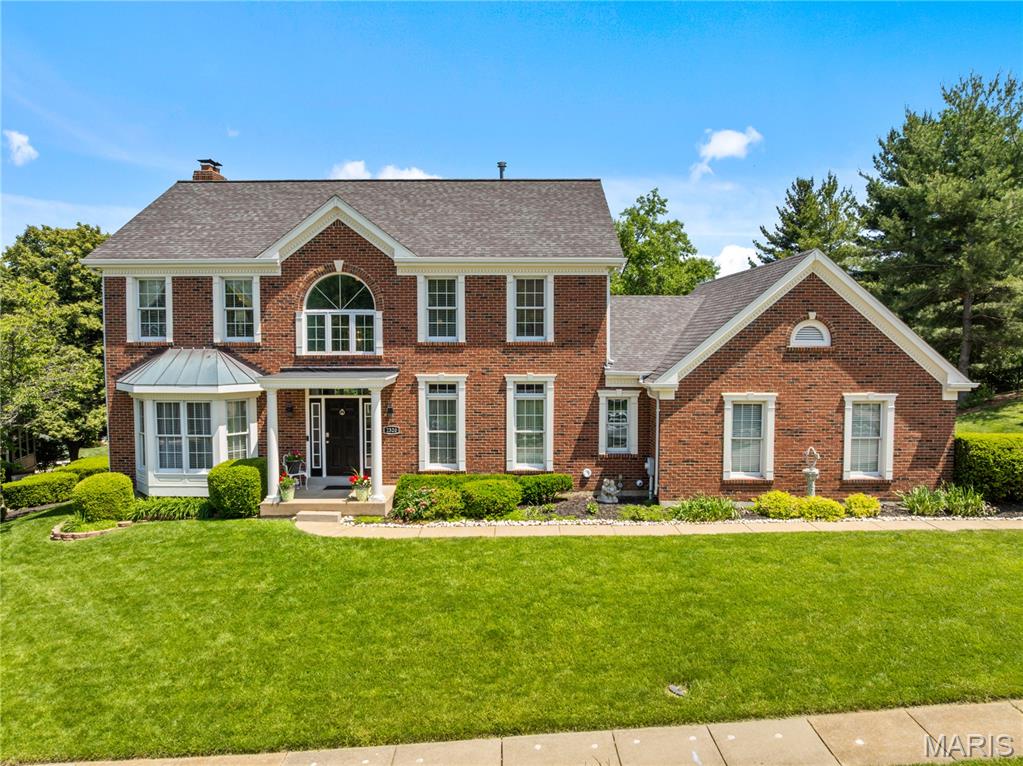 Set on a spacious lot with nearly 3,900 square feet across three finished levels, this inviting two-story home offers plenty of room to live and entertain. A two-story entry welcomes you inside, where wood floors, custom millwork, and 9-foot ceilings add warmth throughout much of the main level. Formal living and dining spaces feature bay windows and wainscoting, while the family room with a fireplace flows into the expansive kitchen, complete with granite countertops, 42-inch cabinetry, a center island, a pantry, a planning desk, and an adjoining breakfast room. A vaulted sunroom overlooks the backyard, and the main-floor laundry adds convenience. Upstairs, four generously sized bedrooms include a spacious primary suite with a walk-in closet and an en suite bath with double vanities, a soaking tub, and a separate shower. The finished walk-out lower level expands the living space with a large recreation room featuring a second fireplace, a fifth bedroom, a full bath, and abundant storage. Outdoor living includes both a covered patio and an elevated deck, ideal for relaxing or entertaining. Additional highlights include a side-entry three-car garage and a location in the highly rated Parkway West School District, close to shopping, schools, and major highways.