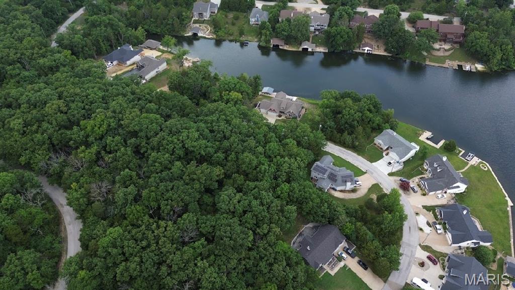 Lakefront Living at Its Finest!  This sub waterfront, buildable lot with breathtaking views offers a perfect canvas for your next dream home right next to new construction. You’ll enjoy convenience and tranquility located just 5 minutes north of Hillsboro and 30 minutes from Greater St. Louis. This is more than just land—it’s a lifestyle.  Amenities include four lakes, a white, sandy beach area, campgrounds, golf courses, swimming pool, fitness center and more. Feel free to explore this amazing opportunity and create your scenic fun-loving lakeside retreat!