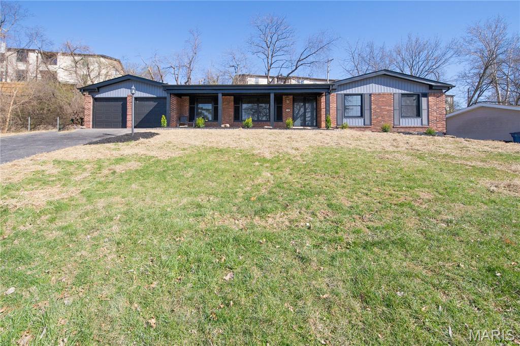 SHOW STOPPER! Welcome home to this refreshed mid-century modern ranch with a brand-new exterior and designer interior updates throughout. This 3 bed, 2 bath home blends classic architecture with modern finishes, featuring new luxury vinyl plank flooring, recessed lighting, and a striking fireplace accent wall.
The fully updated kitchen offers new cabinetry, quartz countertops, stainless steel appliances, and modern fixtures, while the sunroom provides a unique space with custom paneling and new tile flooring.
Need more space? The partially finished basement adds 600+ sq ft of additional living space, plus a bonus room perfect for a home office, gym, or flex space.
Outside, the yard has been regraded with new seed and landscaping, creating a large private outdoor area to enjoy.A rare combination of mid-century design, modern updates, and major exterior improvements, all conveniently located near parks, shopping, and highways.
