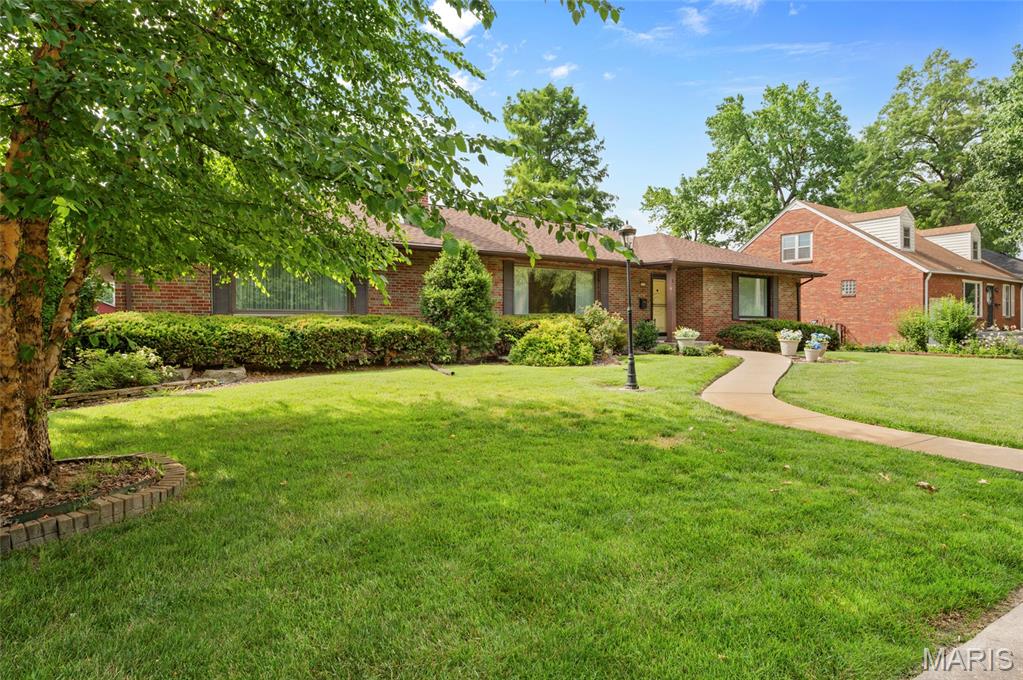 OPEN HOUSE SATURDAY 7/11 FROM 1:30 TO 3:00!  Spacious one-story home in a prime location directly across from Wilson Park.  This well designed home offers generous living space with two oversized main level bedrooms, a formal dining room, and an open living and dining area perfect for entertaining.  Kitchen offers an abundance of cabinet space.  Enjoy cozy evenings by the stunning see-through fireplace that connects the main living room and family room.  Convenient main floor laundry adds to the homes functionality.  The finished lower level provides even more flexible living space with a family room, laundry room and three bonus rooms ideal for home office, hobby room, gym or guest space.  Outside you will appreciate the beautifully landscaped backyard creating a peaceful garden-like setting.  The fenced backyard offers privacy and includes a shed for lawn and garden essentials.  A two car attached garage with convenient rear home entry completes this exceptional property.  With this spacious layout, abundant flexible space and desirable location this home is ready to welcome its next owners.   Additional photos coming 7/10.  Appliances. tv lower level and family room tv stand stays.  Roof new in 2023.  Water heater new in 2021.    Buyer to verify all information provided as it is gathered from various sources.