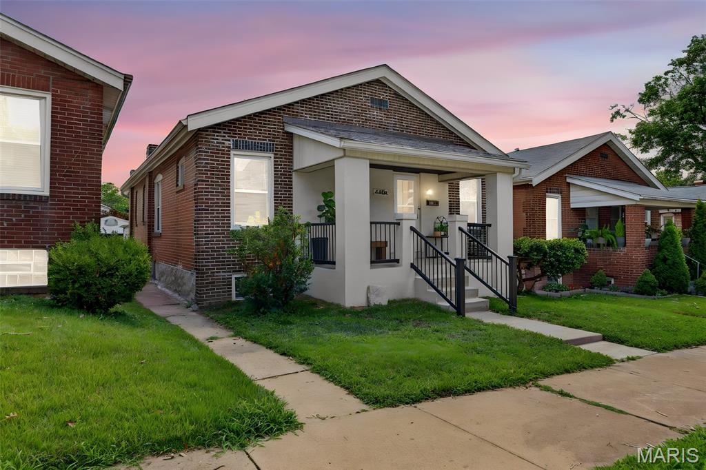 Move right into this beautifully renovated bungalow that perfectly combines classic charm with today's most sought-after finishes. Ideally located within walking distance to Starbucks, shopping, restaurants, and everyday conveniences, this home offers the lifestyle you've been searching for.

One of its standout features is the true primary suite—a rare find at this price point—complete with its own private full bath. Two additional bedrooms and a second beautifully updated bathroom provide plenty of space for family, guests, or a home office.

The stunning kitchen is designed to impress with crisp white shaker cabinetry, elegant marble looking countertops, classic subway tile backsplash, and a full stainless steel appliance package. The spacious open-concept living and dining areas create the perfect setting for everyday living and effortless entertaining.

Need even more space? The large enclosed back porch offers endless possibilities as a family room, playroom, home office, fitness area, or relaxing sunroom. Outside, you'll find a fully fenced backyard with room for kids, pets, gardening, or outdoor gatherings.

Parking is another exceptional bonus, featuring a rare oversized two-car detached garage with alley access, plus additional off-street parking in front of the home.

From the high-end renovations and functional floor plan to the unbeatable walkable location, this move-in-ready home offers incredible value. Opportunities like this don't come along often—don't miss your chance to own one of the best homes available in this price range!