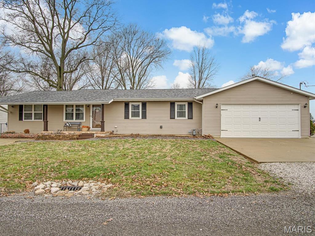 Welcome to this well-maintained 3 bedroom, 2 bath home located in the desirable Triad School District in St. Jacob! This property offers space, functionality, and great outdoor living. The primary suite features an ensuite bath and walk-in closet, creating a comfortable retreat. An ample-sized laundry room with space for a convenient drop zone area to add everyday practicality, providing the perfect space to keep coats, shoes, and bags organized as you come and go. The partially finished basement provides additional living space and a  "tiki" bar along with a partially finished but fully functional bathroom, offering great potential for future expansion. One of the standout features of this home is the attached 6-car garage, perfect for car enthusiasts, hobbyists, storage, or workshop space. Garage doors on both ends provide for easy access. Step outside to enjoy the fully fenced backyard, complete with an above-ground pool, attached deck, and storage shed—ideal for relaxing, entertaining, and enjoying warm Midwest summers. Conveniently located with easy access to nearby communities while still enjoying the charm of St. Jacob living.