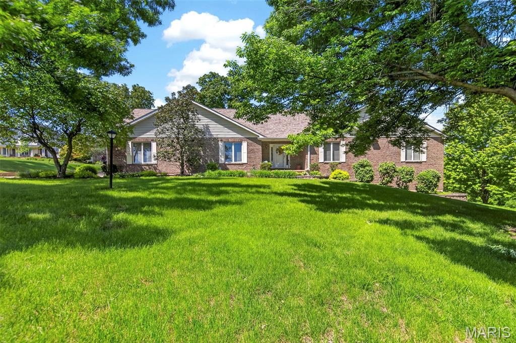 Back and better than ever!  Welcome to your private country retreat! Nestled on nearly 3 scenic acres with picturesque lake views, this stunning 3 bed, 3 bath ranch offers over 3,300 sq ft of beautifully designed living space, a 3-car side-entry garage, plus an additional 20x22 lower-level garage—perfect for extra vehicles, a workshop, or storage. The heart of the home is the charming country kitchen, featuring a huge walk-in pantry, stainless steel appliances including a newer range and dishwasher, and easy access to a screened-in porch—perfect for enjoying peaceful mornings or sunset views over the lake. The inviting living room showcases a cozy wood-burning fireplace, skylights that flood the space with natural light, and access to a second screened deck with even more breathtaking views. The main level includes two spacious secondary bedrooms and a generous primary suite featuring a tray ceiling and full bath, creating a comfortable and functional layout. The finished lower level is ideal for entertaining or relaxing, complete with a second wood-burning fireplace, rec space with bar, full bath, and abundant storage. Thoughtful updates include a newer roof (2019), luxury vinyl plank flooring throughout the main floor, new water softener (2021) and brand new HVAC complete with 12 yr transferable warranty (2026). The Seller has also provided a clean septic report for added peace of mind.  Enjoy the best of country living with space, privacy, and nature all around—while still being just 8 miles from local wineries, dining, and entertainment. This is the perfect blend of tranquility and convenience!