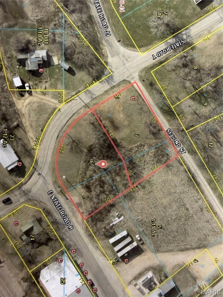 Great Double Lot in High Traffic Location in center of Stoutland State Roads T, H & JJ and not too far from Stoutland School.  Lots of possibilities, City is open to Residential or Commercial with approval