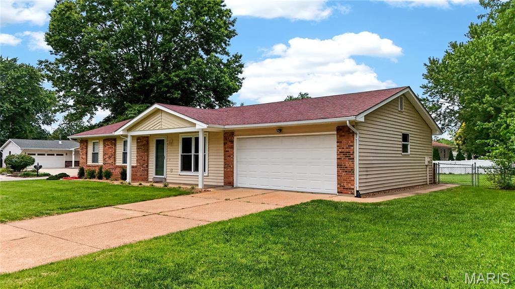 Buyers, this is the home you've been waiting for! Conveniently located in the highly sought-after Francis Howell School District with easy access to major highways, shopping, dining, and entertainment. This beautifully maintained 3-bedroom, 3-bath home is move-in ready. Step inside to find newly refinished hardwood flooring, fresh neutral paint throughout, and updated laminate flooring in the kitchen and bathroom. Additional features include six panel doors, ceiling fans, and kitchen black appliances, including a gas range, dishwasher and microwave. The spacious kitchen offers custom oak cabinetry, neutral countertops, and a neutral custom backsplash. The oversized garage provides abundant storage space and includes a convenient service door leading to the fenced backyard.  Outdoor living is a dream with an oversized patio and deck, creating the perfect setting for relaxing or entertaining family and friends. The professionally finished lower level adds valuable living space and features recessed lighting, brand-new carpeting and padding, a full bathroom, and a versatile area ideal for a home office, workout area, or additional recreation space. Seller is also including the kitchen refrigerator and washer/dryer in this home sale. Don't miss your opportunity to own this exceptional home and build equity while avoiding the ever-increasing rent payments.