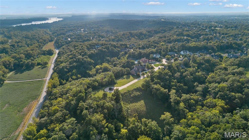 Exceptional opportunity for new construction with renowned Schaeffer and Mills on a wooded 1.83-acre cul-de-sac lot in the private gated section of prestigious WindCastle, a community known for its timeless architecture and superior craftsmanship with existing homes ranging from $1M to over $5M. Ideal situation for custom build with mature trees & access to sewer trunk line, electric & water line. Conveniently located just minutes from shopping, restaurants & Whitmoor Country Club with easy access to Hwys 94 & 364. Award-winning Francis Howell School district.