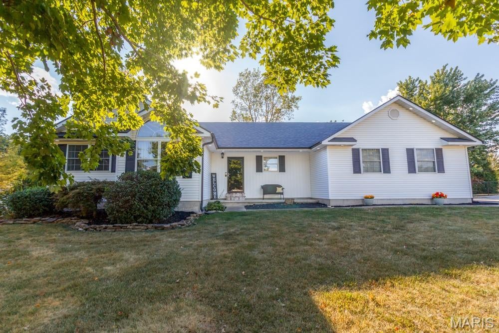 Welcome home to this beautiful and well-maintained 4 bedroom, 3.5 bathroom home situated on just over 2 acres on a spacious corner lot! Inside, you’ll find a warm and inviting layout with a beautiful kitchen featuring granite countertops, plenty of custom cabinetry and room for everyday living and entertaining. The large primary suite offers plenty of space to unwind, while the finished lower level provides even more room for a family room, recreation area, home gym, playroom or additional living space. Step outside to enjoy the large covered back porch overlooking the property, perfect for relaxing or entertaining. In addition to the attached garage, this property features an impressive 30x50 detached shop that is both heated and cooled with its own half bath, offering tons of space for vehicles, hobbies, storage or a workshop. With over 2 acres, multiple garage and shop spaces, a great floor plan and a clean, move-in ready feel throughout, this property has so much to offer!