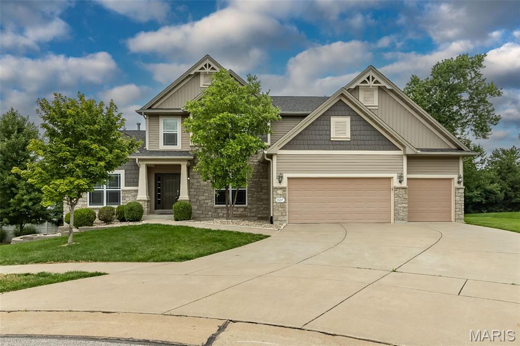 Nestled on a tranquil cul-de-sac lot, this exquisite 1.5-story Craftsman-style home offers the perfect blend of luxury, comfort, and timeless design. Step inside the inviting foyer and be greeted by soaring 9-foot ceilings, a stunning see-through fireplace that creates a warm, elegant ambiance, and a dramatic wall of windows that fills the home with natural light.

The luxurious main-floor primary suite is a private retreat featuring a tray ceiling, spacious walk-in closet, and spa-inspired bath complete with dual vanities, a soaking tub, and separate walk-in shower.

Designed for both everyday living and entertaining, the heart of the home is the chef’s kitchen showcasing a large center island, abundant 42-inch cabinetry, double ovens, gas cooktop, and a generous walk-in pantry. Conveniently located nearby are the laundry room and access to the expansive 14x16 cedar deck — the perfect setting for outdoor gatherings and relaxation.

Upstairs, you’ll find a versatile flex space along with three generously sized bedrooms and two full bathrooms, providing ample space for family and guests.

The finished lower level expands the living and entertaining possibilities with a sprawling recreation area, kitchenette, additional bedroom, full bath, and two bonus rooms ideal for a home office, fitness studio, media room, or guest accommodations. 

New roof in 2024, kitchen appliances upgraded in 2025 which include new gas cook top, Bosch dishwasher and advanced KitchenAid microwave without turntable. 

This exceptional home offers endless opportunities for luxurious living and entertaining.  A must see!