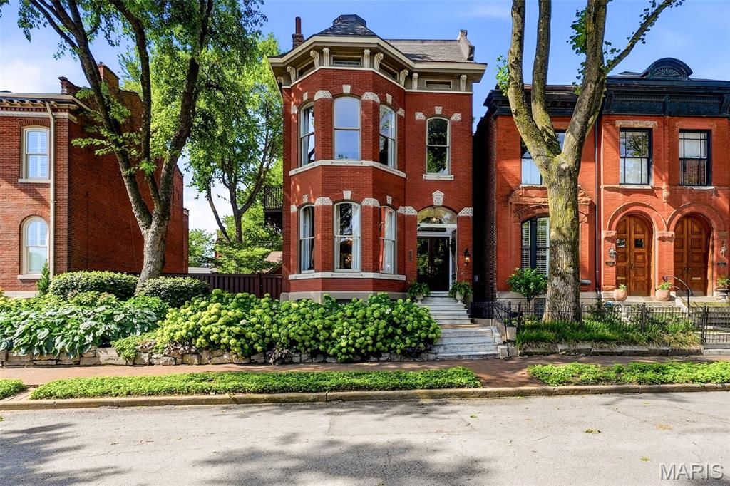 *Entered for Comparable purposes* A rare Lafayette Square offering where historic character, grand proportions, and an exceptional outdoor setting come together. Set on a double lot in one of St. Louis’ most beloved historic and walkable neighborhoods, this striking late-19th-century residence delivers the architectural presence you hope to find in a historic home, paired with thoughtful updates for modern living.

Inside, the home offers 4 bedrooms, 3.5 baths, two living areas, a mud room, and an impressive collection of indoor and outdoor living spaces. Original charm is complemented by refinished and restored details, while functional gas fireplaces in the parlor and second-floor den add warmth and ambiance. The third-floor primary suite features newly installed hardwood floors, and the second-floor guest bedrooms have new carpet. Custom doors, restored windows, repaired plaster, and fresh paint throughout multiple living spaces and bedrooms further enhance the home.

Outdoor living is truly exceptional. Two decks and a private rooftop with downtown St. Louis and Gateway Arch views, while the expansive private grounds offer an outdoor kitchen, custom fire pit, multiple gathering areas, brick pathways, and professionally redesigned landscaping. The grounds are designed for everything from quiet mornings to memorable entertaining.

The detached two-car garage is a destination of its own, with access from both the street and yard, insulation, an indoor basketball hoop, and new garage doors and keypads. Practical improvements continue throughout the property, including a new third-floor roof, parapet wall, gutters and gutter guards; new water heater; new third-floor air-conditioning unit; updated thermostat; irrigation back-flow pump; security system updates; and a new range/oven. Ten windows, side windows, and stained glass have been restored while balcony flooring, railings, doors, and frames have also received attention.

Recent 2026 work includes repaired plaster and fresh paint in the exercise room, bedrooms, second-floor living room, third-floor primary, and first-floor parlor/living room. Every improvement has been thoughtfully undertaken while preserving the distinctive character that makes this home so special.

Bold without being showy, sophisticated yet inviting, this is a home made for living, entertaining, and enjoying everything Lafayette Square has to offer. With its remarkable double-lot setting, architectural character, spectacular rooftop views, extraordinary garage, and beautifully designed grounds, this is an opportunity that is truly difficult to replicate.