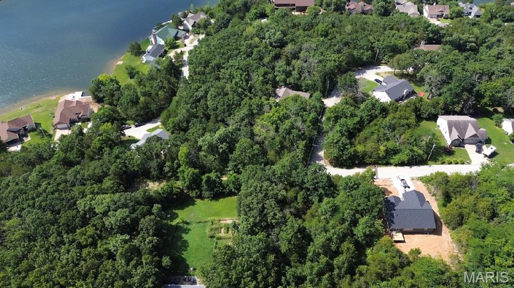 Oversized Lot Large Corner Lot: Right down from the BIG LAKE and right next to NEW CONSTRUCTION! Buy as an individual lot for lake access or check out the nearby lots to purchase as a package and save, save, save! These ready-to-build home sites are located in this private, gated, resort-style community with 4 lakes, golf course, campgrounds and more. Perfect for builders to market to anyone seeking a peaceful, recreational lifestyle away from St. Louis, but still very close for easy family visits. Also perfect for get-away lake home. Enjoy the golf course, lake, boating, fishing, clubhouse, pool, etc. Just 20 minutes from South County! Builders Package: