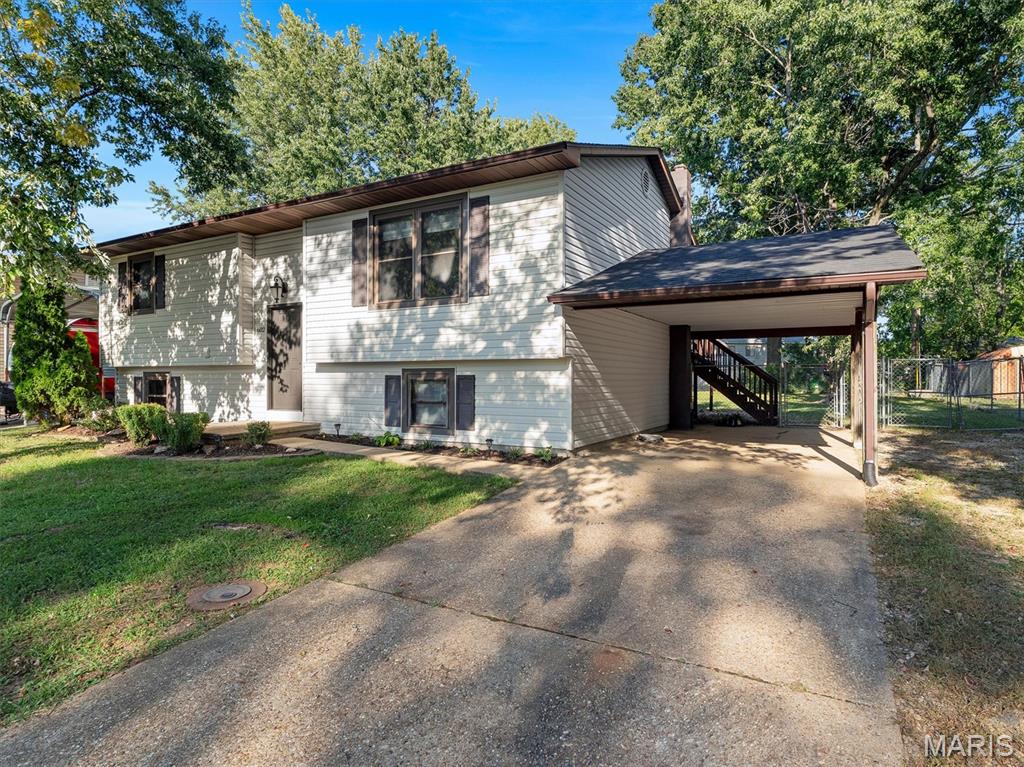 Discover comfort, flexibility, and convenience in this inviting split-level home located in Crawford County within the Sullivan School District. The home offers 3 bedrooms and 2 full baths, plus a lower-level office that could also serve as an additional sleeping room, guest space, or hobby room.

Upstairs, the bright living room flows into a well-equipped kitchen with stainless-steel appliances. Step directly from the kitchen onto the large back deck, an ideal setting for outdoor dining, entertaining, or relaxing while overlooking the fenced yard.

The walk-out lower level expands the home's living space with a comfortable family room, made even cozier by a free-standing wood stove. This level also includes the flexible office/sleeping room, a laundry room with washer and dryer included, and direct walk-up access to the backyard.

Additional features include an attached carport, established landscaping, and valuable recent updates, including a new roof installed in August 2026, plus a furnace and water heater replaced within the past five years.

Situated in a pleasant neighborhood close to the hospital, police department, and park, this home combines practical updates, versatile living space, and a convenient location. Schedule your showing and see all this Home has to offer!