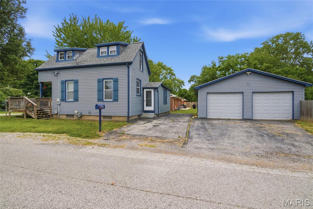 Welcome to 6101 W. C St in Belleville! This charming 3 bed 2 bath home offers over 1200 square feet of living space and plenty of character through out. Situated on a corner lot with an amazing 2 car detached garage and a nice fenced in backyard! This home features a functional layout with comfortable living areas, a main floor primary bedroom & great potential for buyers looking for space, convenience & charm. Outside you will appreciate the covered porch/patio area, detached garage and additional parking spaces. This home sits on a unique property package that includes 3 additional lots in the back that total approximately 1 acre perfect for outdoor entertaining, gardening, future possibilities or simply enjoying more space. Whether your looking for your next home, investment opportunity or  a property with room to grow, this Belleville home is full of potential!