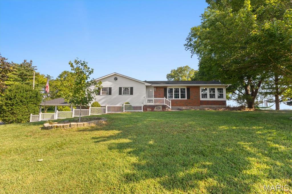 BACK ON THE MARKET DUE TO BUYER HOUSE SALE CONTINGENCY FALLING THROUGH!  Charming 4-bedroom, 2-bath home situated on approximately 2 acres in Ruma and located within the Red Bud School District. The main level features 3 bedrooms, 1 bathroom, a comfortable living room, and a spacious kitchen/dining area with abundant kitchen cabinets and newer appliances. The home has had many updates on the main level such as fresh paint, light fixtures, flooring and bathroom renovations. 
An enclosed porch provides the perfect space for a home office, reading area, or relaxing and enjoying crisp fall evenings. The finished basement offers an additional bedroom, updated bathroom, laundry hookups, and a fallout shelter with 6-inch concrete walls on each side.
Outside, the property includes a single-car garage with an extended two-car carport, a large pole barn shed, garden space, mature pecan trees, and blackberry bushes. With many updates throughout and plenty of room to enjoy the outdoors, this property offers comfortable country living with convenient access to nearby communities.