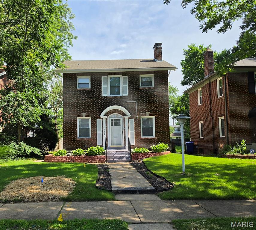 Beautifully updated home in nestled in University City! Offers one full and 2 half bathrooms on each level, combined living/dining room, fireplace, partially finished lower level. Landscaped front and large level back yard, suitable for an additional 3 or 4 car garage!  The two-car parking pad already exist with rear access thru the alley! Seller is currently using the 3rd upstairs bedroom as a full closet.  All three upstairs bedrooms have their own closet and entry. Open main floor great for entertaining!  Seller is leaving all of the newer stainless appliances for your convenience! Convenient side door leads to your Full Level Landscaped Yard!  Great for get togethers! Security Alarm System is owned but seller is willing to negotiate!